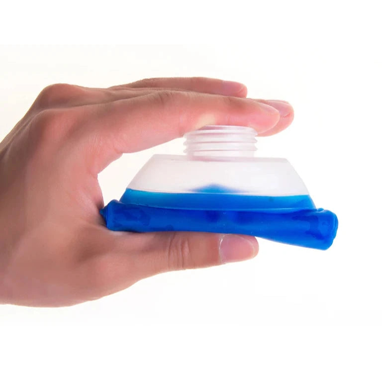 Hand holding folded collapsible flask